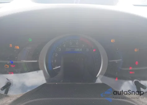 2011 Honda Insight from USA, damaged, VIN JHMZE2H34BS005548